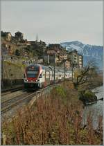 Eine kleine Fototour mit drei Spurweiten:   Auf der Normalspur setzen seit dem Fahrplanwechsel die RE Genve - Lausanne - Vevey neue Akzente im Lavaux; hier der 511 112 als RE 2720 bei St-Saphorin.
