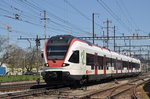 RABe 521 013, auf der S3, verlässt den Bahnhof Pratteln. Das abzweigende Gleis führt auf eine Strasse und in ein Industriegebiet, vom wo aus auch diese Aufnahme am 05.05.2016 entstand.