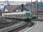 bls - Triebzge RABe 535 110 und 535 005 bei der einfahrt in den Bahnhof Spiez am 24..03.2012