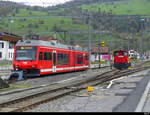 CJ 1000 mm + 1435 mm - GTW  ABe 2/6 634 + Tm 232 182-7 im Bahnhof von Glovelier am 04.11.2022