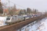 Dafr kmpft man sich mit dem Rad durch den Schnee ;-) HUPAC Taurus (182 600-7) mit einem Ganzzug Autotransportwagen in Magdeburg Diesdorf am 14.02.2010.