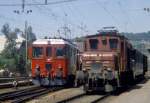 Seetalbahn Nachmittag in Wildegg. De 4/4 1665 kehrt vom Opalinus-Ton Verlad auf der Strecke Wildegg-Schinznach Bad (jeweils ein Ucs auf der Strecke vom Silo in den Bahnwagen umf�llen) in die Seetalgruppe zur�ck. De 6/6 15301 ist abgestellt f�r den Abendg�terzug Wildegg- Lenzburg- Beinwil- Berom�nster. (scan von Negativ, etwa 1975)