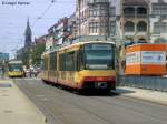 stadtbahn-karlsruhe-hier-nur-die-s-bahnen 30.06.2010: TW 885 als S5 nach Knielingen Rheinbergstra�e. Hier h�lt er in der Station Tullastra�e. Der TW tr�gt Werbung vom Karlsruher Zoo. Daneben erreicht auch schon TW 310 als Tram 1 nach Durlach Turmberg die Station Tullastra�e.