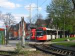 stadtbahn-koln-hochflurstadtbahnen-b-wagen-und-k5000 Am 10. April wartet TW 5143 der mit einem 2. unbekannt gebliebenen Wagen vom Typ K5000 als Linie 4 in der Wendeschleife an der Haltestelle 'Ubierring' dass sie die R�ckfahrt antreten k�nnen.