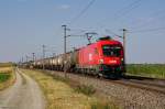 1016 048 fhrt mit einem Kesselganzzug am 16.07.2013 bei Wampersdorf in Richtung Wiener Neustadt.