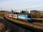 Die 1016 023 mit einem REX nach Linz am 08.02.2014 unterwegs bei Haiding.