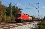 1116 185 mit einem gemischten Gterzug am 07.10.2009 in Haar.