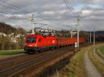 Dir 1116 187 am 03.01.2012 mit einem Holzzug unterwegs bei Ingling.