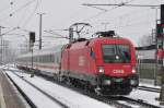 1116.273 mit dem Ic 1280 bei der Einfahrt in Wörgl Hbf und eine leichten Schneefall am 24.1.15  