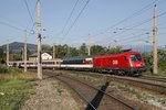 1116.050 fährt mit EC151 am 8.09.2016 durch den Bahnhof Eichberg.