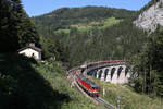 Vom neuen Kalte-Rinne Fotopunkt aus,fahren 1144.281+1142.673 mit G-54703 beim Ghega-Museum am 30.8.17 bergwärts.