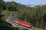 Die neue 1144.270 fährt mit 1144.221 und den G-54703 in wunderschöner Semmeringlandschaft bei Breitenstein am 21.8.18 bergwärts.