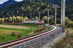 1144 221-9 nähert sich mit dem D 735 (Villach Hbf - Lienz), Berg im Drautal.