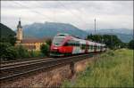 4024 057 ist als RB 5122 von Telfs-Pfaffenhofen nach Rosenheim unterwegs und wird vor dem Kloster Raisach abgelichtet. (04.07.2008)
