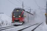Trotzdem starke Schneefall,nur mit 5 Minute versptung verkehrte die R5870 von Hochfilzen nach Wrgl am 13.02.2009.