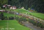 1116 038-9 ist mit einem gemischten Gterzug von Schwarzach nach Mnchen unterwegs,bei St.Johann im Pongau aus unserer Ferienwohnung herausfotografiert (sterreichurlaub 14.08.09)