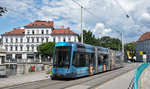 Graz - Variobahn 235 mit der Show Factory Vollwerbung als Linie 5 am der Keplerbrücke am 04.06.2016.