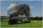 764.411R mit einem Fotogüterzug am 26.6.2015 zwischen den Haltestellen Neudorf/Stainztal und Herbersdorf.