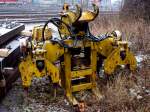 Stopfmaschine f�r einen 2Wegebagger. Dieses Anbauteil wird an den Ausleger ...