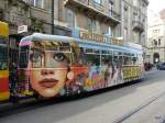 strasenbahn-basel-bvb-blt BLT - Trambeiwagen B 1320 mit Werbung unterwegs in der Stadt Basel am 31.10.2009