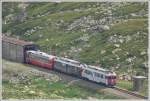 strecke-berninabahn-sm-ti BEX951 mit ABe 4/4 III 51 und 52 verl�sst die Scala-Galerie. (14.07.2010)