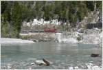 Ein G�terzug aus Disentis mit Ge 6/6 II 707 Scuol  ...