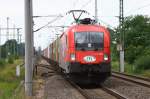 ITL mit Taurus 1116 238 zieht einen Containerzug durch Pritzier. ...