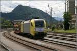 ES64U2-033 rollt vom Brenner komment mit einem leeren Autozug in ...