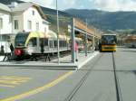 GTW ATR 100 nach Bozen,rechts das Schweizer Postauto nach Zernez,Graub�nden/Schweiz.Mals ...