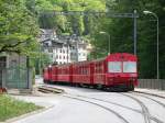 Ge 4/4 II 623 Bonaduz mit Steuerwagen 1701 steht am ...