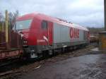 OHE Osthannoversche Eisenbahnen AG OHE Eurorunner wartet auf die Beladung eines Holzzuges im Bahnhof Arnsberg.