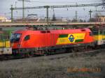 GySEV Eine Taurus-Lokomotive der Raaberbahn (GySEV) mit rot-gelber Farbgebung (Baureihe 1116) in der Nachmittagssonne auf dem Bahnhof Oedenburg. Aufnahme vom 10.2.2008.