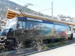 MOB Montreux - Berner Oberland - Bahn MOB - Ge 4/4 8003 mit Vollwerbung im Bahnhofsareal von Zweisimmen am 29.03.2008