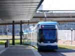 Strasenbahn Zurich Cobra 3058 beim Einfahrt in der Haltestelle Flughafen am 25.04.09