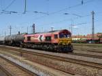 br-266-class-66---jt42cwr Eine halbe Stunde nachdem sie einen Kesselwagenzug in den G�terbahnhof Magdeburg-Rothensee gebracht hatte fuhr Lok DE 668 der HGK mit einem anderen Gazzug Kesselwagen wieder zur�ck (Richtung Magdeburg Hbf). Fotografiert am 23.05.2009