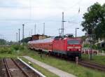 BR 143 mit Zugen 143 566-8 kommt hier mit seiner RB14 in den Bahnhof von K�nigs Wusterhausen reingefahren. Seine Reise  ging von Senftenberg nach Falkensee. 22.05.2009