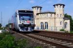 mitteldeutsche-regiobahn-mrb Am 26.05.2009 ist VT001 als MRB88562, in H�he Delitzsch oberer Bahnhof, auf dem Weg von Halle(Saale)nach Eilenburg. Rechts im Bild das imposante Bahnhofsgeb�ude.