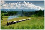 br-77 Am Vormittag des 1.6.2009 standen wir schon an der gleichen Stelle und fotografierten 77.28 bei schlechtem Wetter mit ihrem Personenzug von Timelkam nach Ampflwang. 

http://www.bahnbilder.de/bilder/300619.jpg

Am Nachmittag, beim Fotozug, war das Wetter besser, es wurde aber auch w�rmer, daher gab es so gut wie keine Dampfentwicklung mehr.
