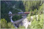 RE 1128 mit Ge 4/4 III 647 Gr�sch auf der ...