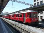 triebwagen RhB - Triebwagen Be 4/4 515 mit 2 Personenwagen 2 Kl. sowie 1 Steuerwagen 1+2 Kl. als Regio im Bahnhof von Chur am 07.05.2009