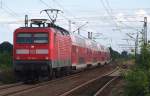 BR 112 112 182-1 kommt hier mit einem RE der Linie 2 von Cottbus nach Rathenow durch L�bbenau/Spreewald gefahren. 19.07.2009