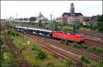 BR 143 mit Zugen DB 143 054-5 mit dem S-Bahnersatzverkehr vor der Kulisse des Berliner Westhafens nach dem Kopfmachen auf dem Weg nach Berlin Gesundbrunnen (Berlin Moabit, 28.07.2009)