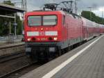 114 029 am 25.Juli 2009 bei der Einfahrt in Stralsund ...