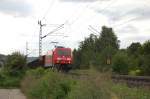 BR 185 mit Zugen Gar nicht mal so dreckig pr�sentiert sich 185 299-5, als sie am 31.7.2009 einen langen G�terzug �ber die Filsbahn zieht. Aufgenommen am km 25,4.