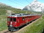 strecke-berninabahn-sm-ti RhB - Bernina- Express 951 von Chur nach Tirano am 19.07.2009 in der 70-Promille-Steigung zwischen Bernina Lagalb und Ospizio Bernina mit Triebwagen ABe 4/4 II 45 + ABe 4/4 II 49 - Ap 1292 - Api 1302 - Bps 2515 - Bp 2521 - Bp 2522 - Bp 2526
