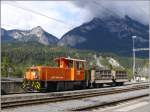 Tm 2/2 119 in Reichenau-Tamins. Im Hintergrund der Kunkelspass und ...