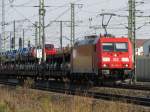 BR 185 mit Zugen 185 380-3 zieht am 18.09.'09 einen langen Auto-Ganzzug hinter sich her, hier kurz vor Lehrte