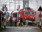 hge-4-4 Nicht viel besser pr�sentierte sich das Wetter in Andermatt am 22.08.2009. Dennoch lassen es sich die angereisten Fotografen nicht nehmen, den GEX mit HGe 4/4 108 aufs Bild zu bannen.