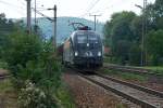 1x16-werbeloks 1116 280 'A1' bringt vor einem G�terzug in Richtung Wien. Die Aufnahme entstand am 18.09.2009 kurz vor Unter Purkersdorf.