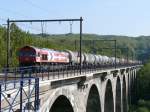 HGK Hafen - Und Guterverkehr Koln Nicht schlecht staunte ich, als mir auf dem Viadukt von Remersdael ein von der DE61 der HGK gezogener Kesselwagenzug entgegen kam. Beim n�heren Betrachten sieht man jedoch, dass an den Seitent�ren die Logos der Rurtalbahn und Trainsport aufgeklebt worden sind. Aufgenommen am 26/09/2009.
